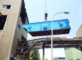 Vibrating screen being lifted into position at a plant